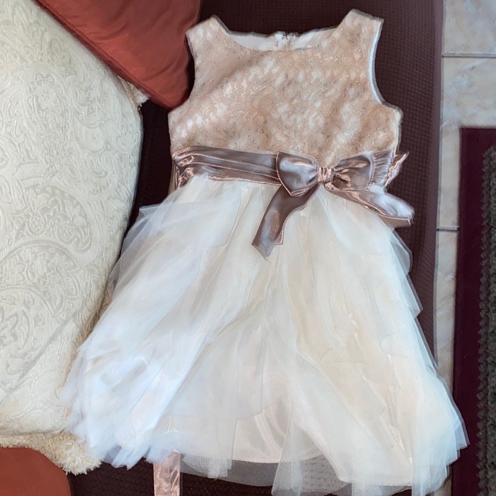 Beige and silver speckled top frilled bottom and dark beige bow worn one time
